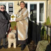 Helene Key, Sales Manager at Chestnut Homes (Right), handing over the iPad to competition winner, Joanna Haselwood, with her pet labradoodle, Lily EMN-220116-214655001