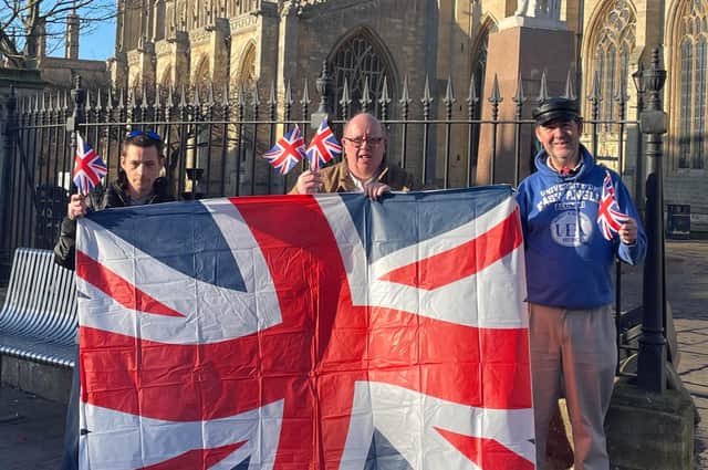 Members of the voluntary group ACE - Chris Skinner, David Wheeler and Mike Gilbert get into the jubilee spirit in Boston's Market Place. Image supplied.