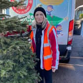 Louise Cotton, Fundraising Officer busy collecting Christmas trees to recycle. EMN-220117-171713001
