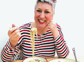 Karen enjoys her delicious mushroom stroganoff