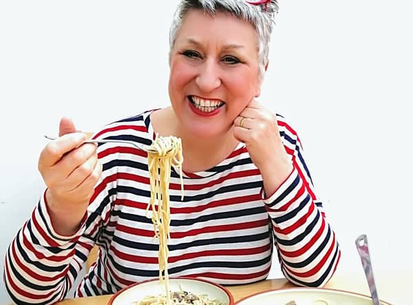Karen enjoys her delicious mushroom stroganoff
