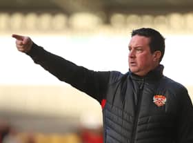 Paul Cox in the dug-out for Kettering at York City earlier this season. Photo: Peter Short