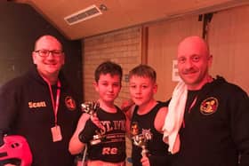The young fighters with Boston coaches Scott Harmon and Matt Mooney.