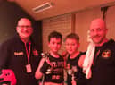 The young fighters with Boston coaches Scott Harmon and Matt Mooney.