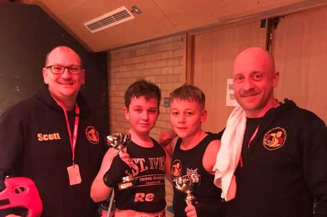 The young fighters with Boston coaches Scott Harmon and Matt Mooney.