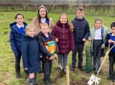 Members of the School Council from Key Stage Two at Ancaster CofE Primary School, helping create the community orchard.