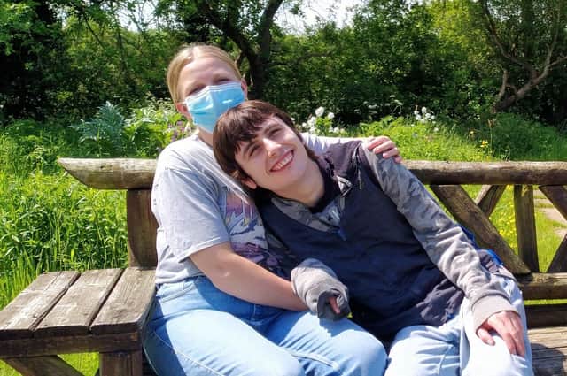 A carer and one of the individuals they support.