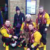 Bonnie with the RNLI lifeboat crew looking none the worse for her adventure on Skegness beach