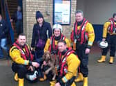 Bonnie with the RNLI lifeboat crew looking none the worse for her adventure on Skegness beach