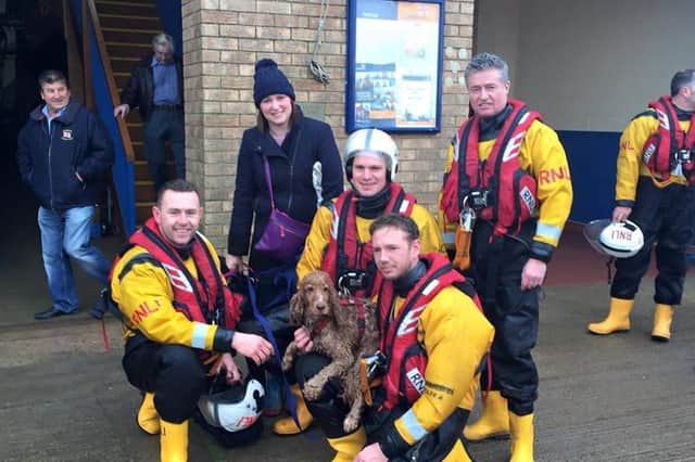 Bonnie with the RNLI lifeboat crew looking none the worse for her adventure on Skegness beach