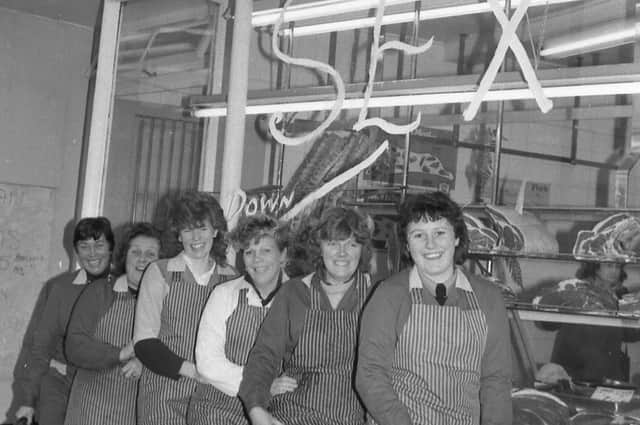 Staff at John Swain's outside the shop in Boston Market Place in 1987.