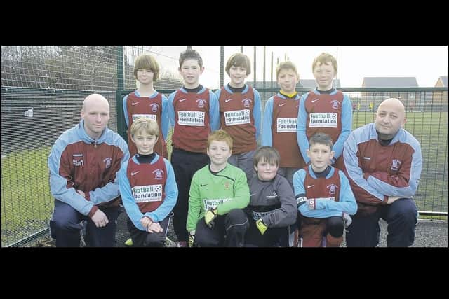 The William Alvey School team who were runners-up in the Lincolnshire Under-11 Tesco Cup final, with football coach Andy Coupland and trainer Dean Pearce.