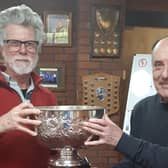 Retiring seniors captain Mike Thornton presents the Bagshaw Bowl to Jim Price (left).