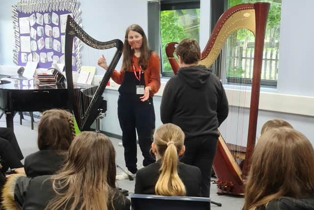 Harpist Ruth Lee during a music workshop delivered to years 7, 8 and 9 last year.