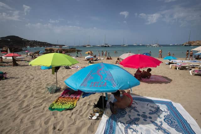 SPAIN: Tourists enjoy a sunny day at Cala Tadira beach. Photo: Getty Images