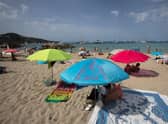 SPAIN: Tourists enjoy a sunny day at Cala Tadira beach. Photo: Getty Images