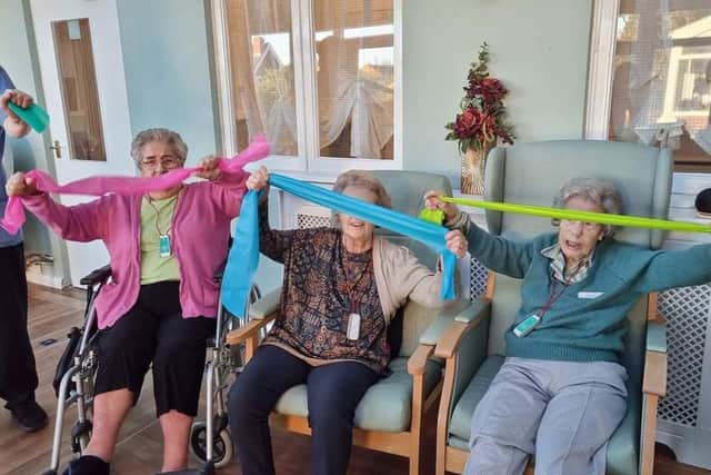 Residents enjoying the chair exercises with movement to music. Pictured are Louise Rider , Doreen Wheat, Dylis Peacock and  Joyce Knight.