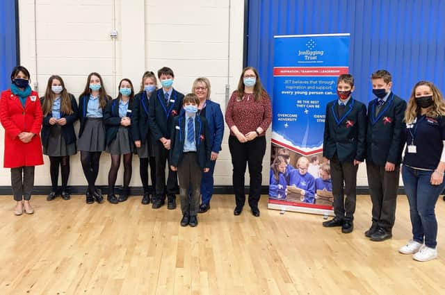 MP Dr Caroline Johnson (centre) and JET CEO, Dr Emma Egging OBE(left) hosted by JET students at St George’s Academy, Ruskington. EMN-220128-155301001