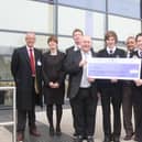 The cheque presentation at Skegness Academy 10 years ago.