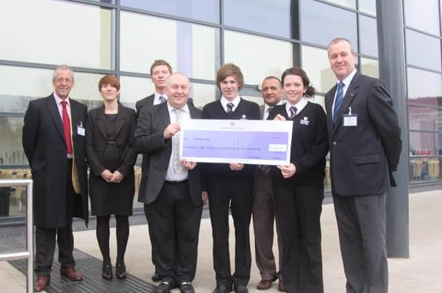 The cheque presentation at Skegness Academy 10 years ago.