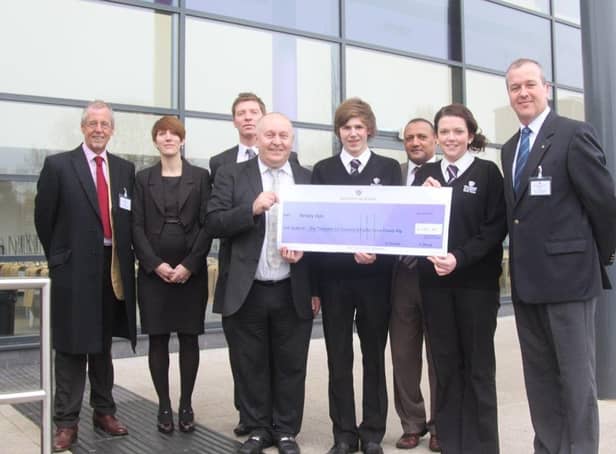 The cheque presentation at Skegness Academy 10 years ago.
