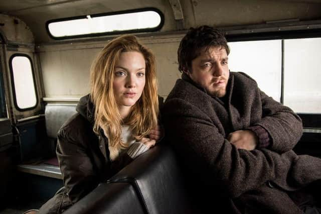 Robin Ellacott (Holliday Grainger) and Cormoran Strike (Tom Burke) in the new ITV crime drama Strike.