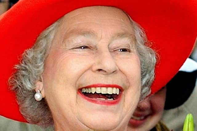 Queen Elizabeth II enjoying a walk about  (photo: Kirsty Wigglesworth/PA Wire)