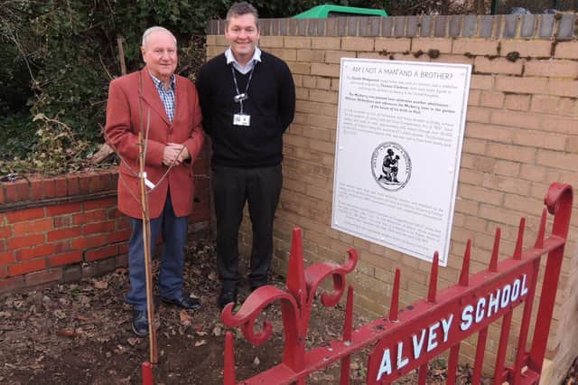 Coun Anthony Brand and William Alvey School headteacher Stephen Tapley planting the mulberry tree. EMN-220702-175650001