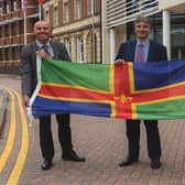 From left, Coun Rob Waltham, leader of North Lincolnshire Council; Coun Phillip Jackson, leader of North East Lincolnshire Council; and Coun Martin Hill, leader of Lincolnshire County Council, pictured with the Lincolnshire flag. EMN-220202-135544001