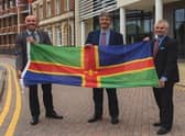 From left, Coun Rob Waltham, leader of North Lincolnshire Council; Coun Phillip Jackson, leader of North East Lincolnshire Council; and Coun Martin Hill, leader of Lincolnshire County Council, pictured with the Lincolnshire flag. EMN-220202-135544001