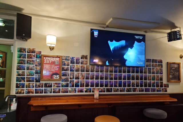 The photo gallery wall at the Stump & Candle.