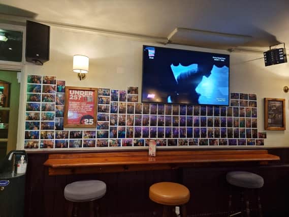 The photo gallery wall at the Stump & Candle.