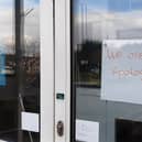 The note on the entrance to truGym, in Boston.