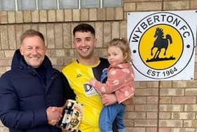 Scott Dawson collects his man of the match prize from Steve Pinner of sponsors DWB Timber Engineering.