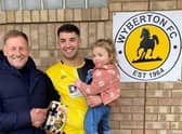 Scott Dawson collects his man of the match prize from Steve Pinner of sponsors DWB Timber Engineering.