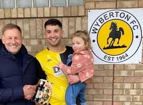 Scott Dawson collects his man of the match prize from Steve Pinner of sponsors DWB Timber Engineering.