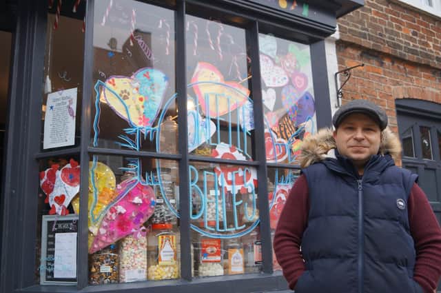 Sweetie Belles co-owner Freddy Wells beside the display window EMN-220902-062116001