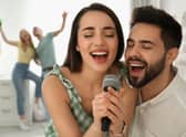 Couple singing romantic ballads on the Karaoke