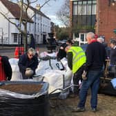 Volunteers get to work in the market place