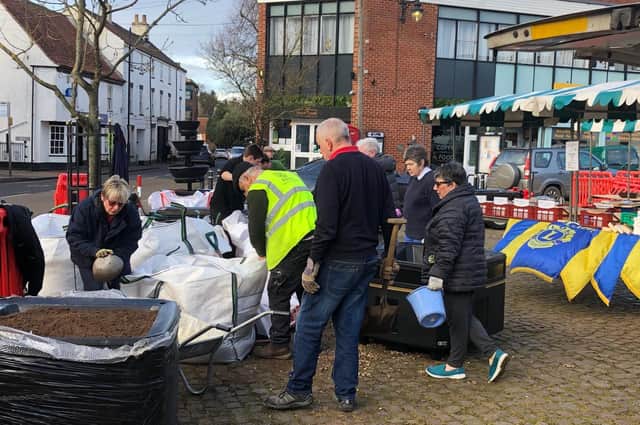 Volunteers get to work in the market place