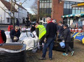 Volunteers get to work in the market place