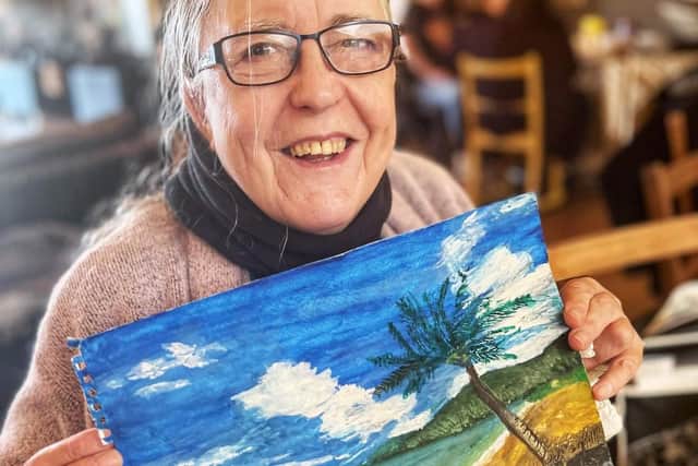 Pamela Harper with her artwork.