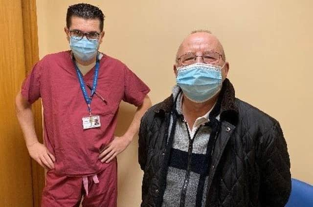 Consultant Urologist Aris Alevizopoulos (left) with Ken Watson (right) of Ancaster before the surgery. EMN-220217-150252001