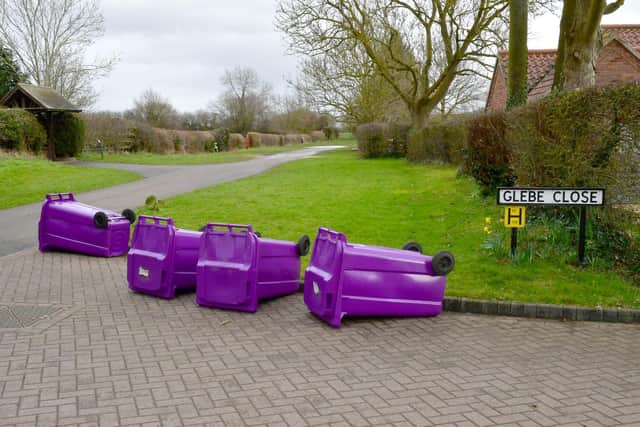 NKDC rubbish collectors were instructed to lay down emptied bins on their rounds today, such as here at Scopwick.