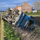 Overturned lorry at South Kyme in the high winds of Storm Eunice. EMN-220218-181814001