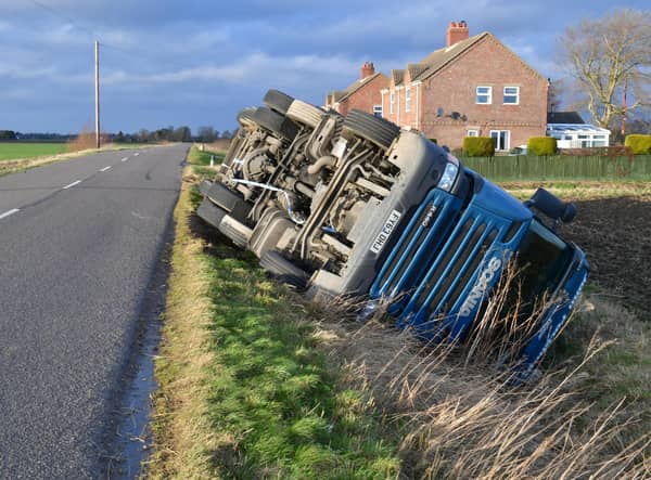Overturned lorry at South Kyme in the high winds of Storm Eunice. EMN-220218-181814001