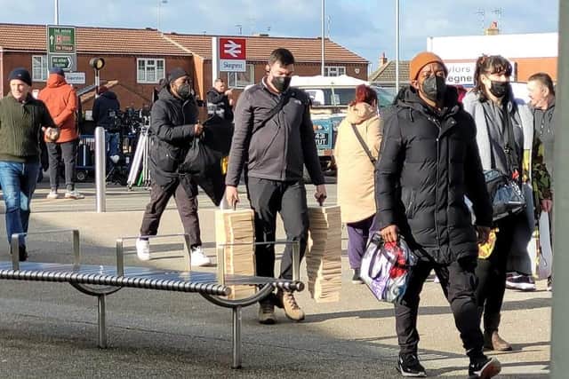 Passengers arriving at Skegness railway station during the filming of Strike. Photo: Barry Robinson.