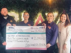 Staff of Skegness Pier with a cheque for £2,090.02 presented to the When You Wish Upon A Star charity.