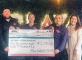 Staff of Skegness Pier with a cheque for £2,090.02 presented to the When You Wish Upon A Star charity.