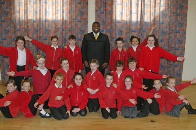 Skegness Junior School pupils with Michael Williams of The Drifters.